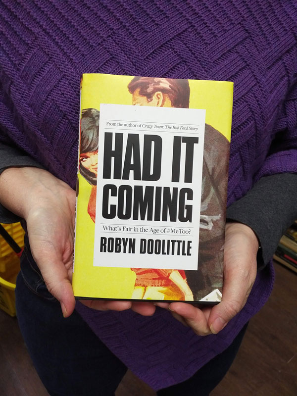 Silent book club member presents a book by Robyn Doolittle