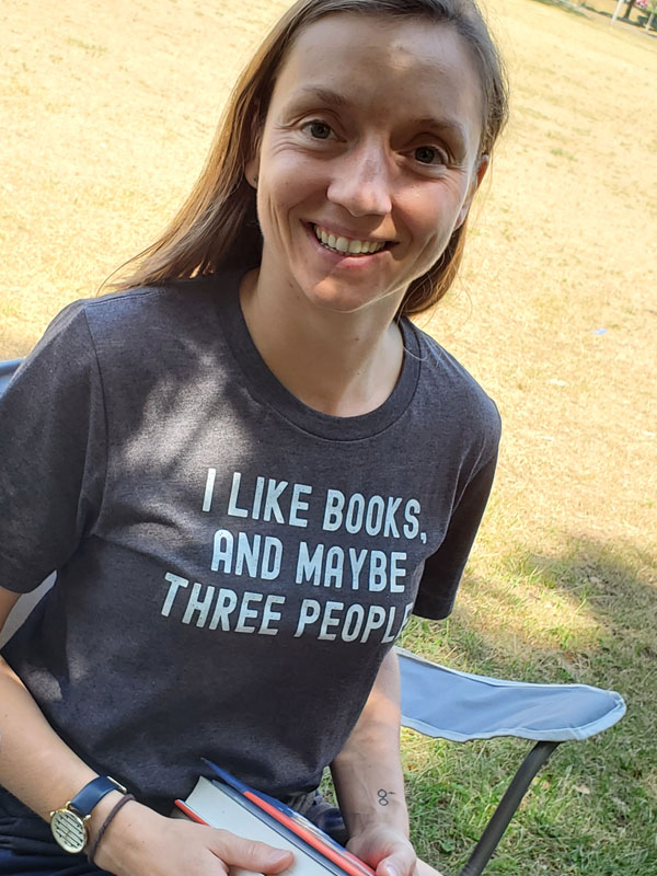 Silent book club member with great bookish T-shirt