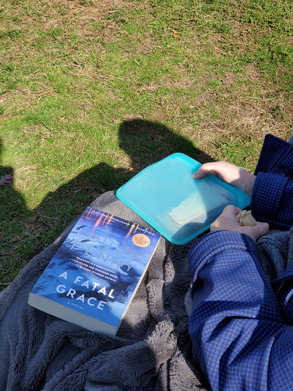 Silent book club member in the park