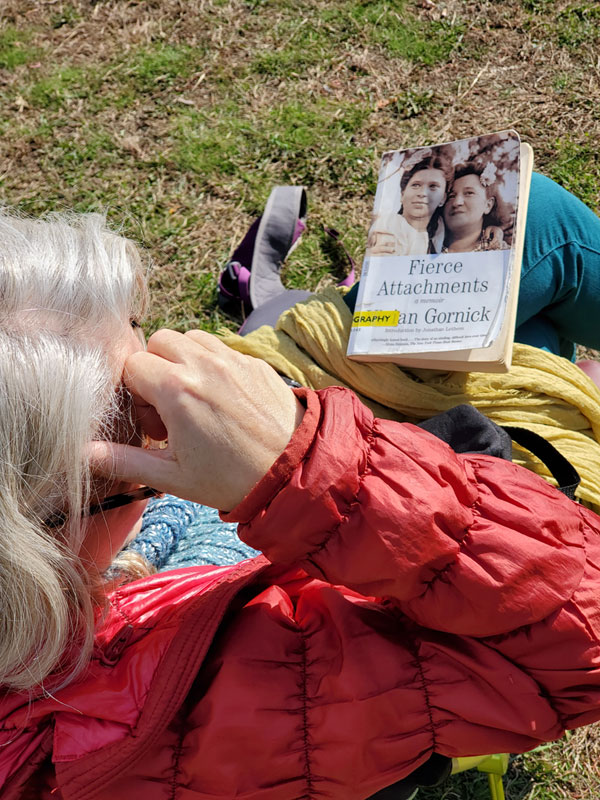 Silent book club member in the park