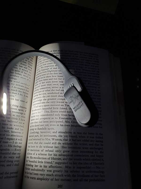 Mighty Bright book light attached to a book