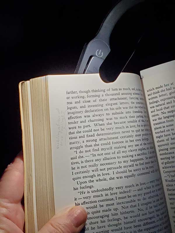 Mighty Bright book light attached to a book