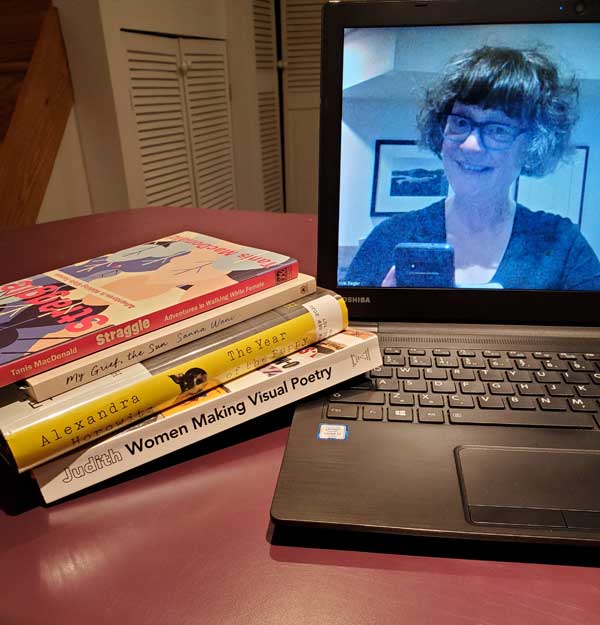 Me, on my computer screen, getting ready for the sbc zoom meeting with my books stacked next to the computer