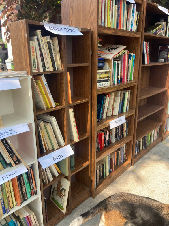 More bookshelves at the Grolier Poetry Museum in Cambridge, Massachusetts, with the tail of a beagle visible in the bottom righthand corner of the picture