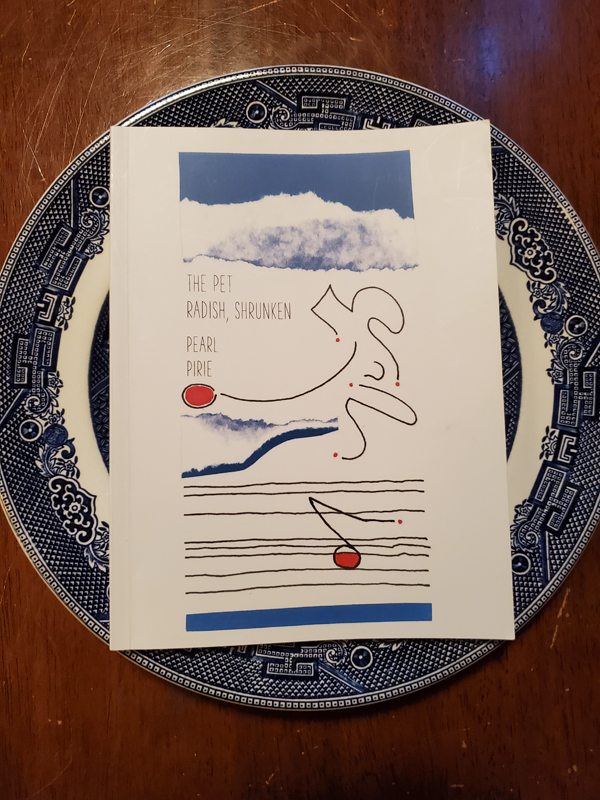 Poetry work The Pet Radish, Shrunken by Pearl Pirie, sitting on a patterned blue plate