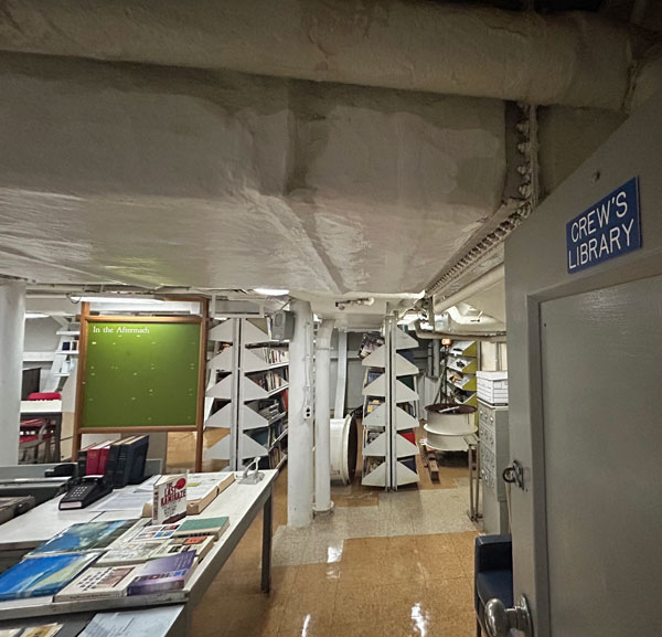 Silent book club member Lisa views the crew library of the Battleship Missouri, part of a Pearl Harbor historic site [Photo by Lisa]