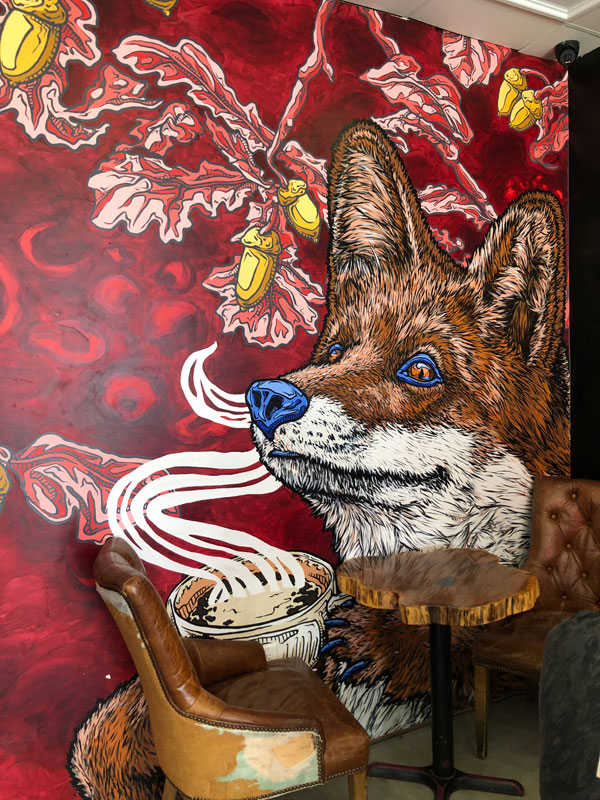 Vibrant painting of a fox on the wall of the East Toronto Coffee Co coffee shop - Photo by Jennifer D. Foster