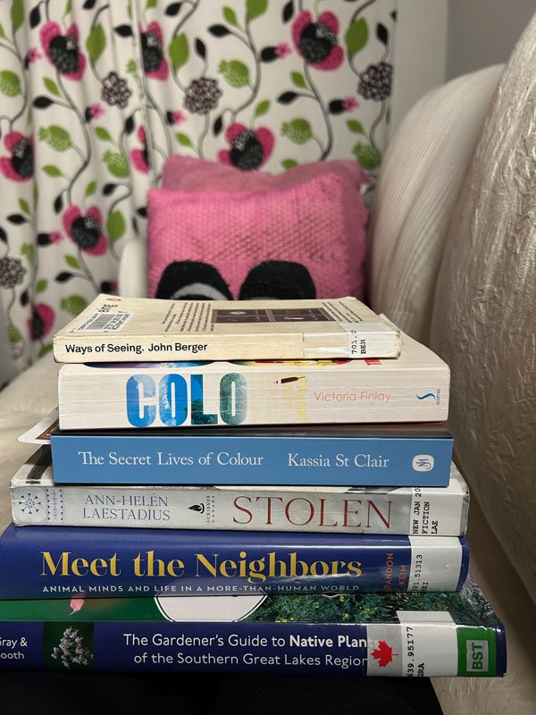 Silent book club member Jess' books, including The Gardener’s Guide to Native Plants by Rick Gray and Shaun Booth (Photo by Jess Bootsma)