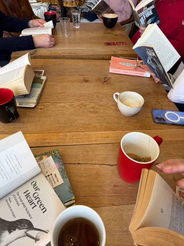 Readers reading at East Toronto Coffee Co, accompanied by coffee and pastries (Photo by Jennifer D. Foster)