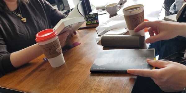 Readers reading at East Toronto Coffee Co, accompanied by coffee and pastries (Photo by Vicki Ziegler)