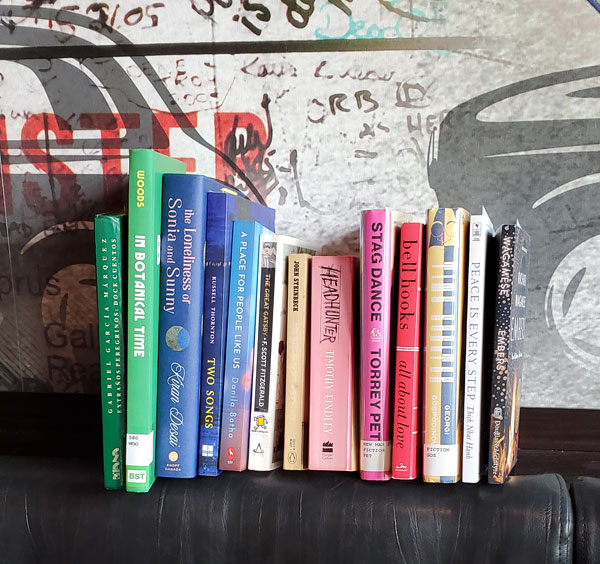 Closeup of the collected books being read by east end Toronto sbc members at the meeting at Firkin on Danforth (Photo by Vicki Ziegler)