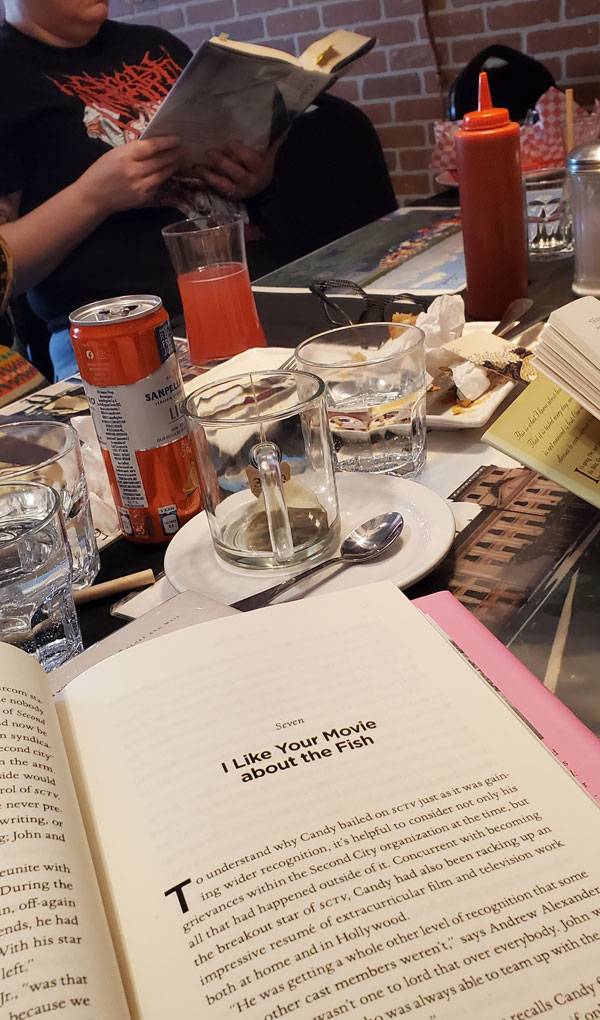Readers reading at Budapest Restaurant, accompanied by refreshments (Photo by Vicki Ziegler)