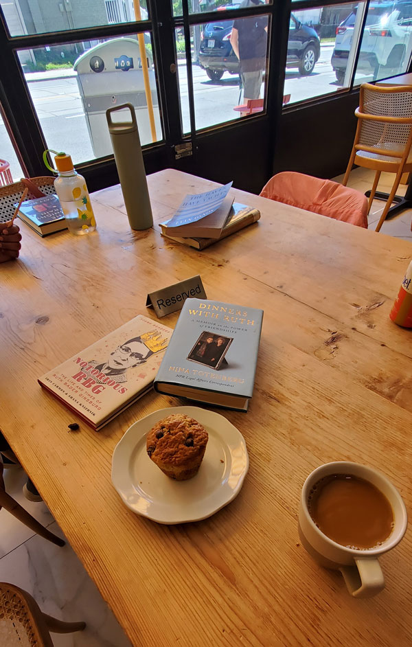 Table, books and refreshments at silent book club meeting at Paper Route Cafe  (Photo by Vicki Ziegler)