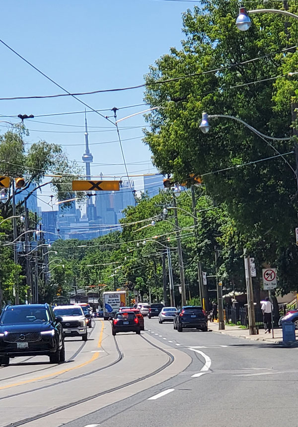 Walking to book club meeting down Kingston Road, with the CN Tower in the background (Photo by Vicki Ziegler)